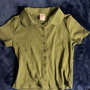 A green crop top with short sleeves